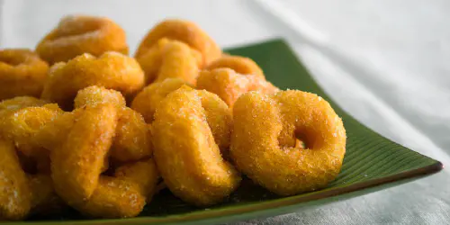 Cómo hacer buñuelos de calabaza. Aprende a preparar rosquillas valencianas, las tradicionales de las Fallas. Paso a paso con fotos.